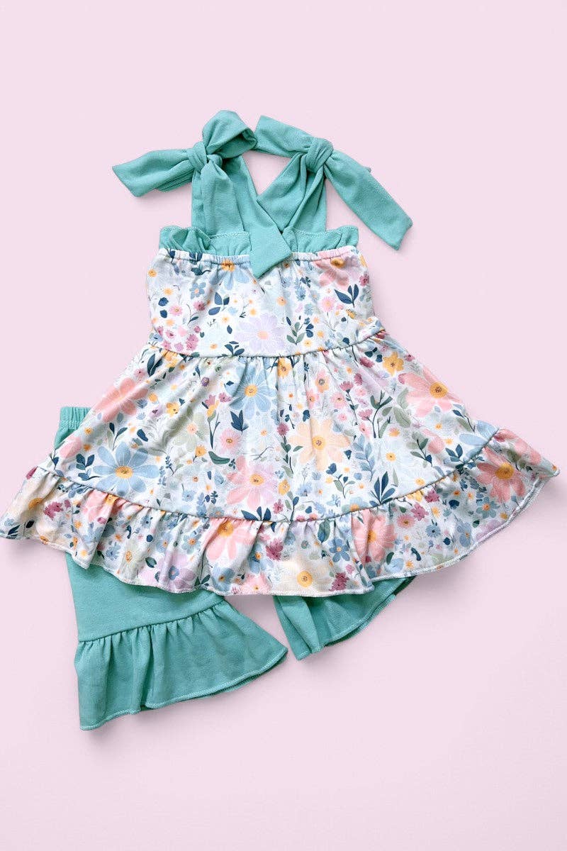 Floral printed ruffle tunic & teal shorts.