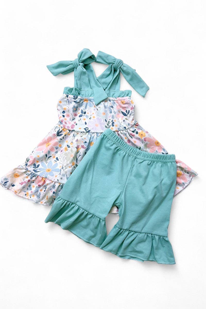 Floral printed ruffle tunic & teal shorts.