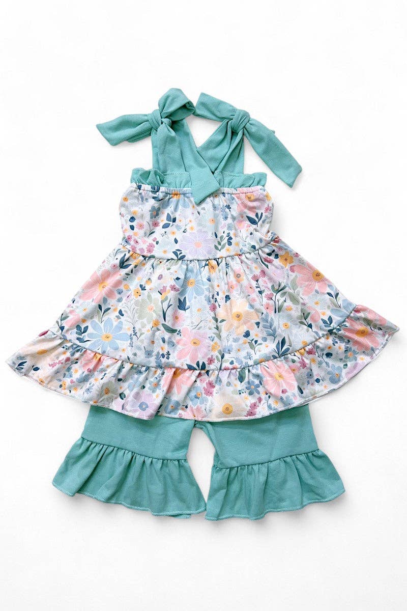 Floral printed ruffle tunic & teal shorts.