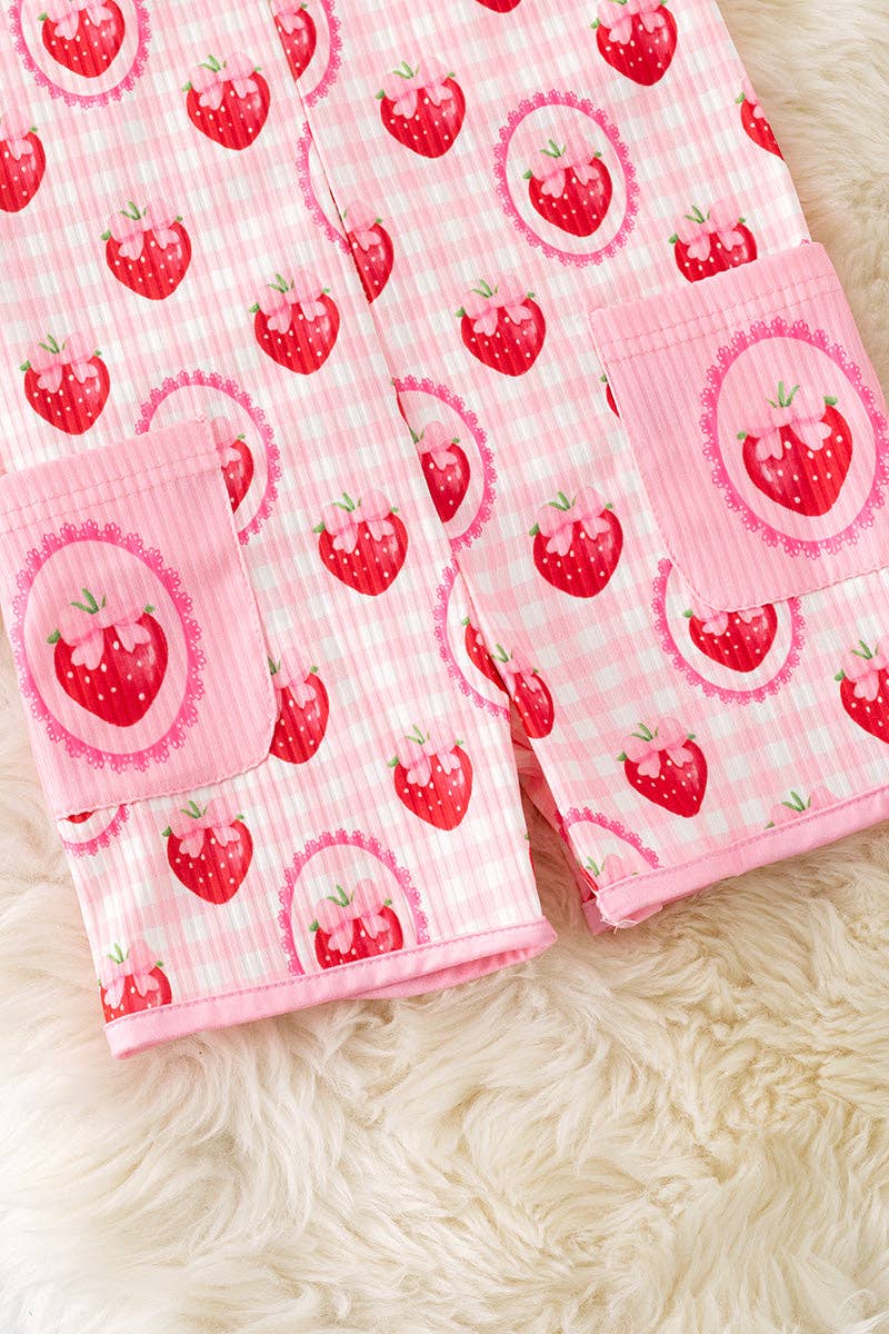 Strawberry printed girls romper with front pockets.