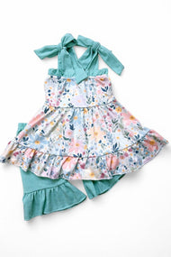 Floral printed ruffle tunic & teal shorts.