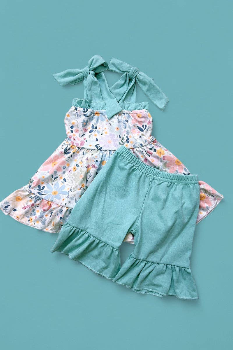 Floral printed ruffle tunic & teal shorts.