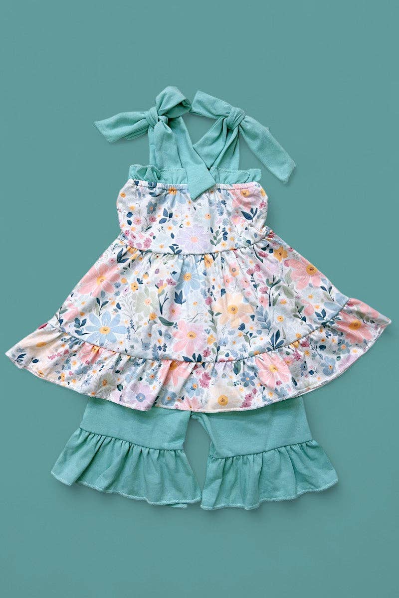 Floral printed ruffle tunic & teal shorts.