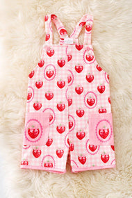 Strawberry printed girls romper with front pockets.