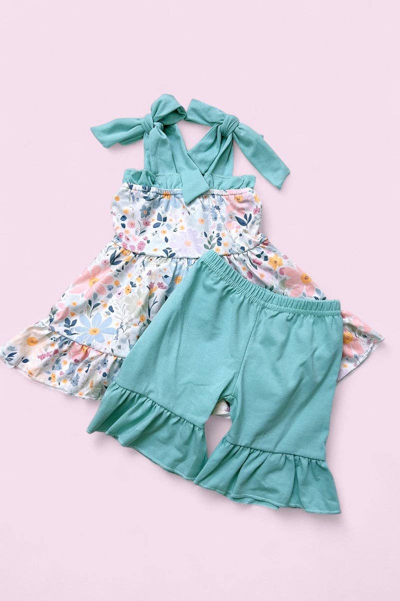 Floral printed ruffle tunic & teal shorts.